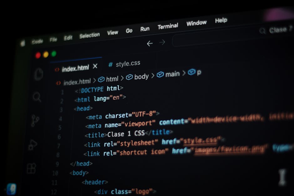 A close-up view of a computer screen displaying lines of HTML code, including tags such as <html>, <head>, <title>, and <meta>. The code is written in a text editor with a dark background and syntax h