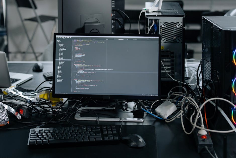 A close-up view of a computer screen displaying lines of HTML code, including tags such as <html>, <head>, <title>, and <meta>. The code is written in a text editor with a dark background and syntax h